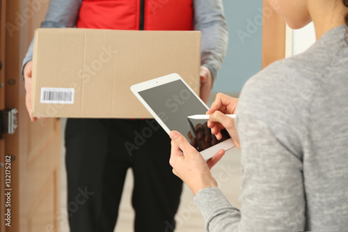 Young woman appending signa...