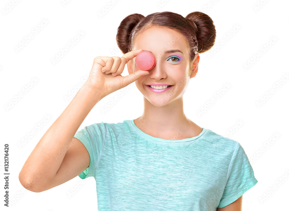 Cute girl with macaroon on white background