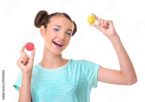 Cute girl with macaroons on...