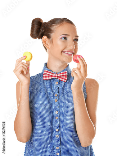 Cute girl with macaroons on...