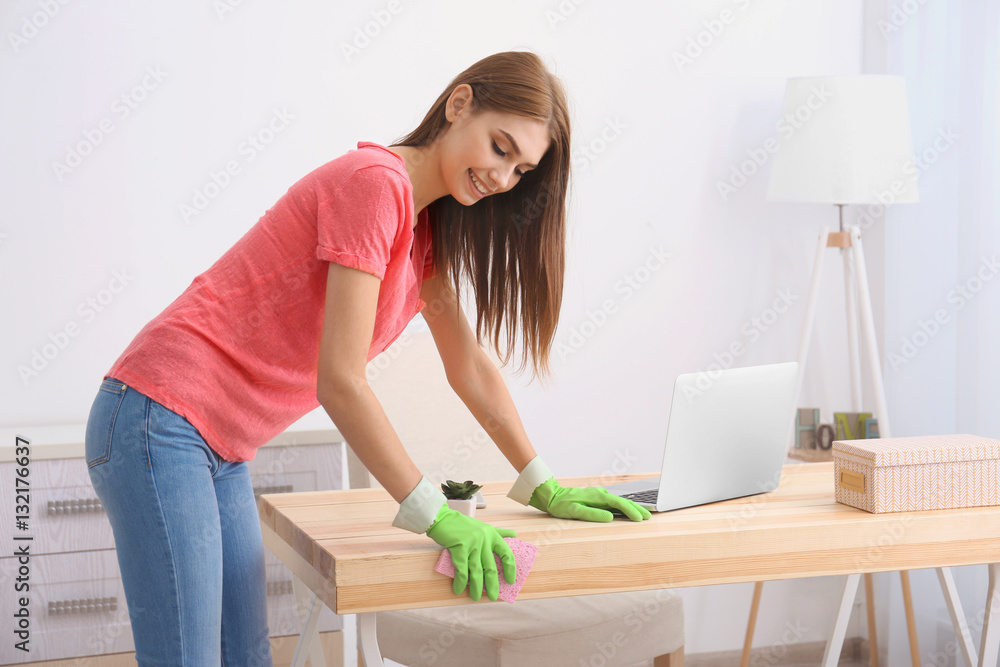 Cleaning concept. Professional cleaner cleaning table in office Cleaning concept. Professional cleaner cleaning table in office