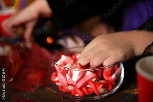 Little boy taking treats on Halloween party