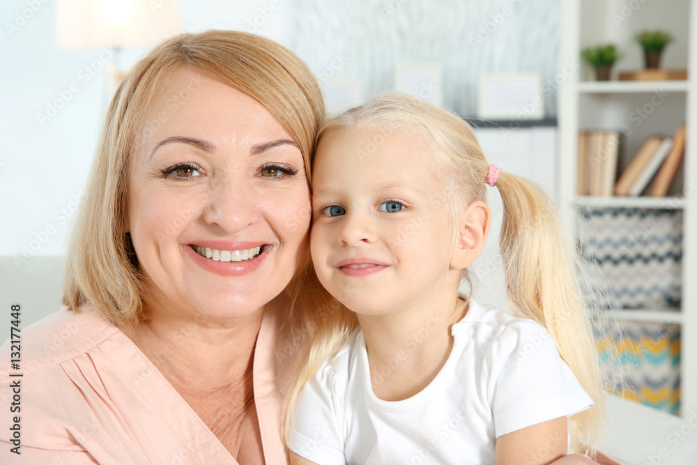 Cute happy girl with grandmother at home Cute happy girl with grandmother at home