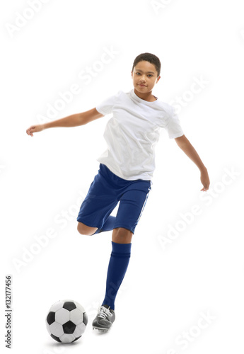 African American boy playing football on white background © Africa Studio