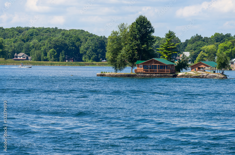 Fototapeta premium Small island with a cottage and a boathouse