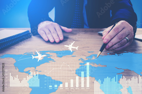 Фотография Businessman  pointing on diagram on table concept for global bus