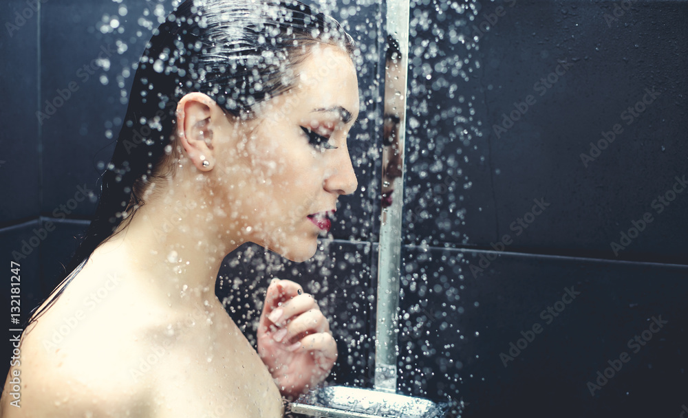 Obraz premium Beautiful sexy young woman washing body in a shower