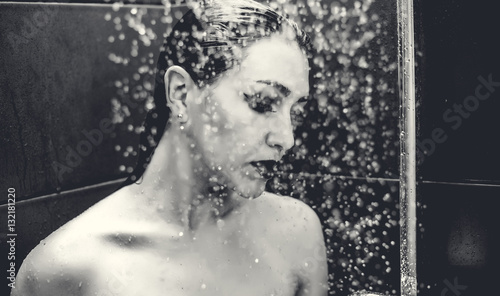 Beautiful sexy  young woman washing body in a shower