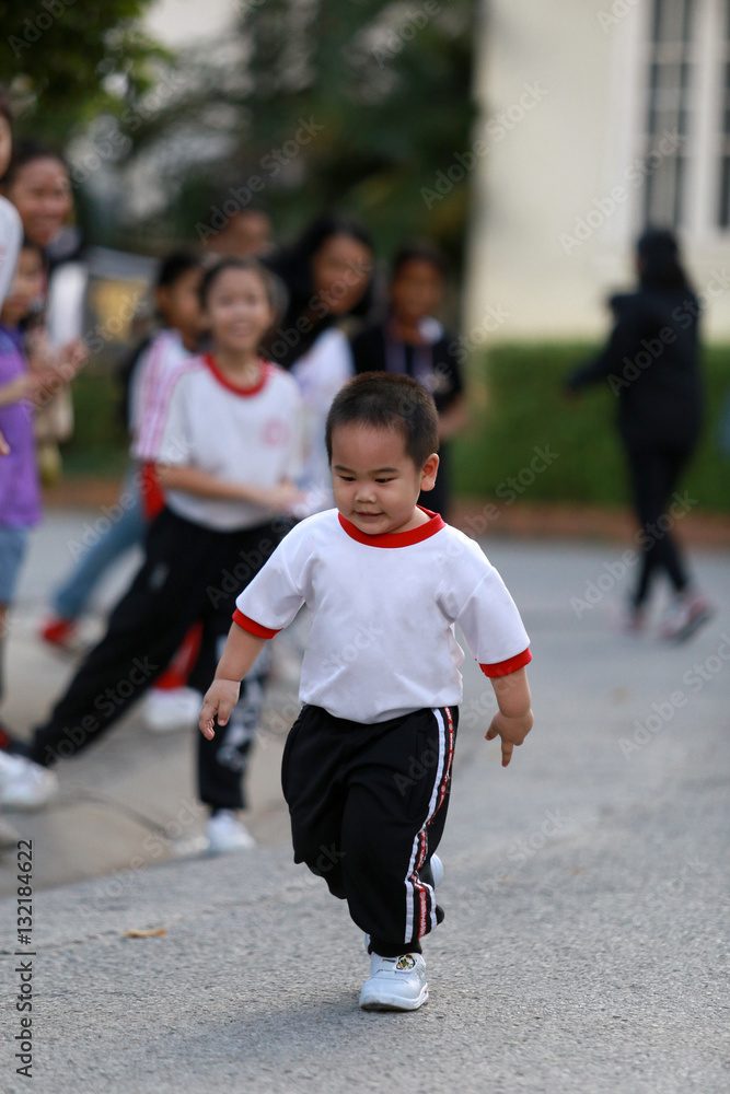 Young student running in school sport event