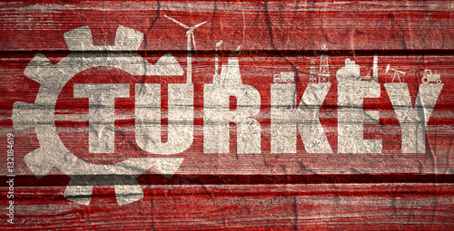 Turkey word build in gear. Heavy industry relative image. Grunge textured backdrop.