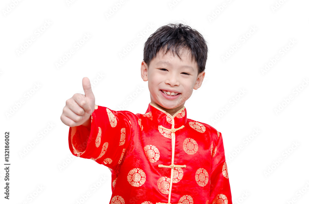Chinese boy in traditional costume smiling and showing thumb up Chinese boy in traditional costume smiling and showing thumb up