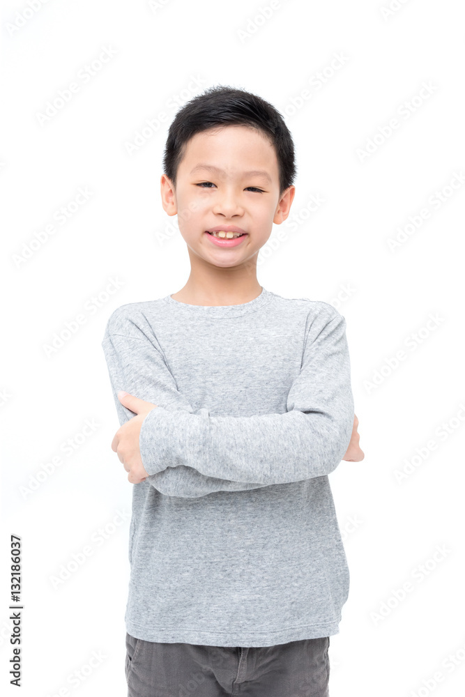Arms crossed Asian boy smiles on white background Arms crossed Asian boy smiles on white background
