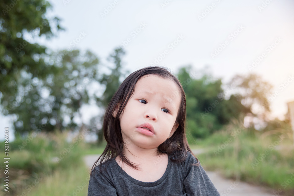 Little Asian girl waiting for her parent come home Little Asian girl waiting for her parent come home