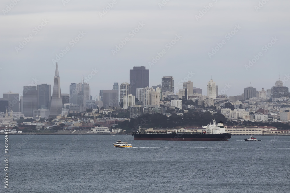 Cargo Ship Gliding On Bay In Front Of San Francisco