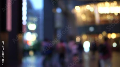Wallpaper Mural people walking in front of blur shopping mall plaza in evening after work Torontodigital.ca