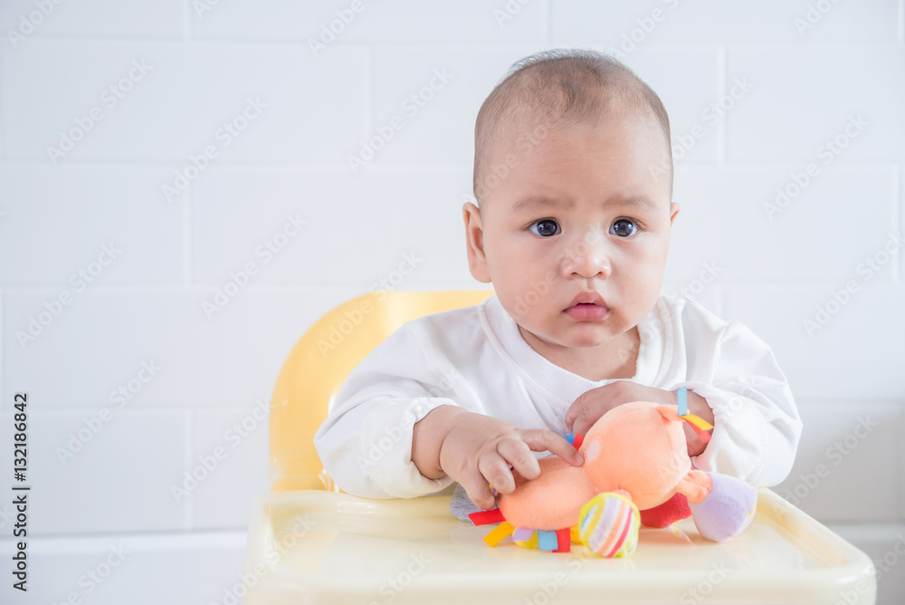 Little asian child sitting on a seat Little asian child sitting on a seat