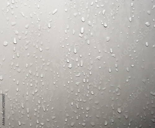 Water droplets adhered on the bathroom door.