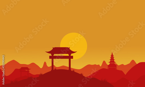 Silhouette of pavilion on hill at sunset