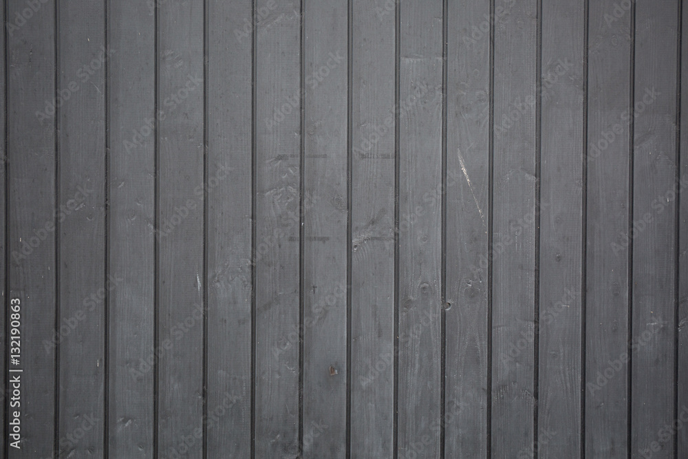 A dark gray background in wooden strips for a modern or urban wallpaper A dark gray background in wooden strips for a modern or urban wallpaper