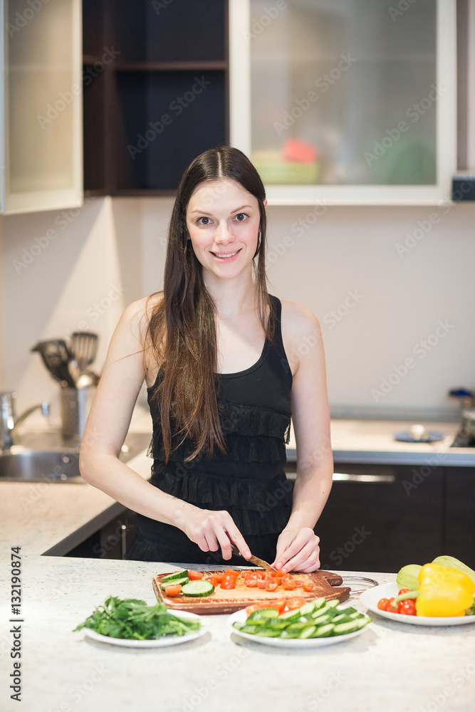Young Woman Cooking in the kitchen.