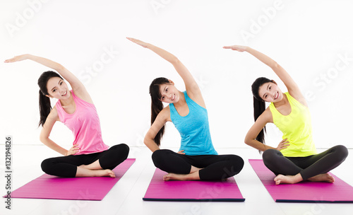 happy young woman Group doing yoga exercises