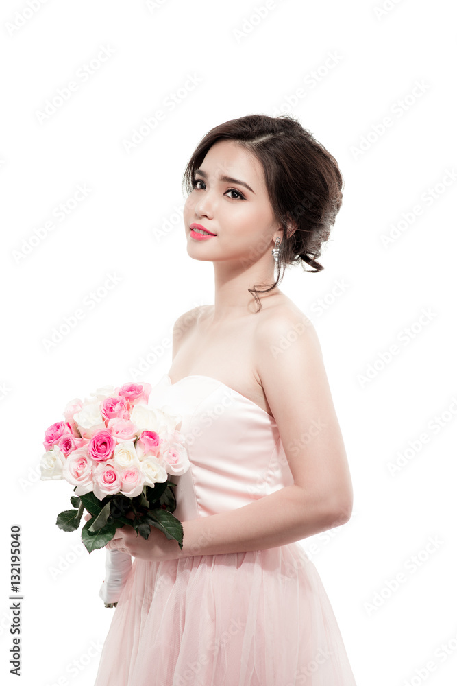 Happy bride with a bouquet of roses. Isolated on white backgroun