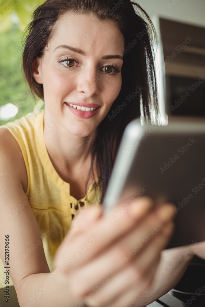Beautiful woman using digital tablet