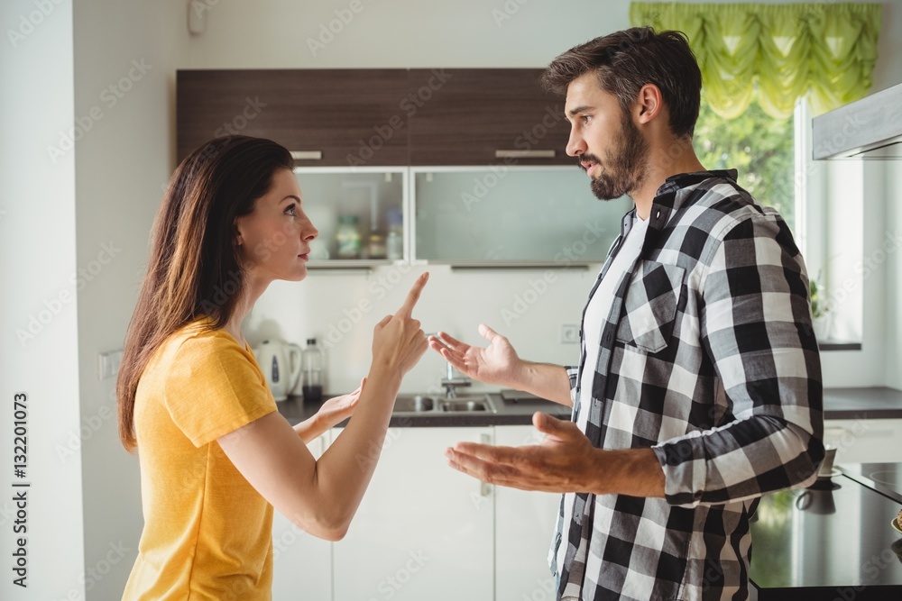 Couple having argument in kitchen Couple having argument in kitchen