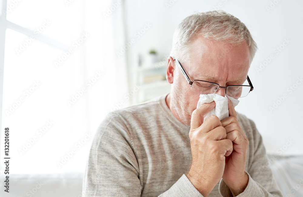 sick senior man with paper wipe blowing his nose sick senior man with paper wipe blowing his nose
