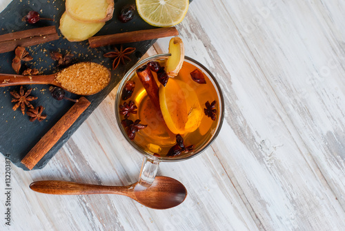 lemon, ginger, sugar and spices - ingredients for a spicy warmin photo