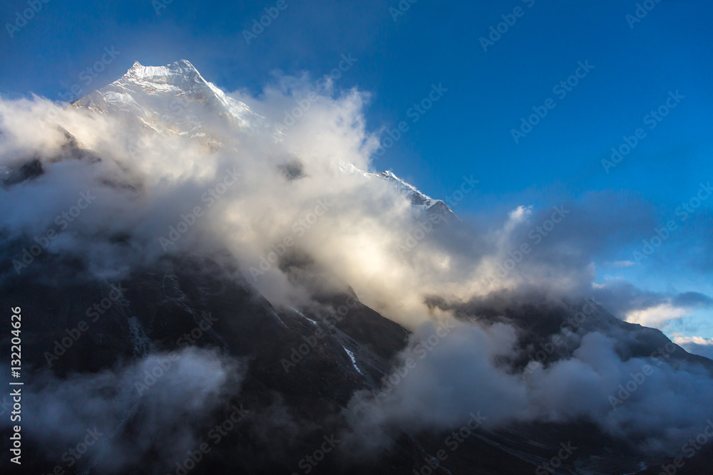 View of Mountain Peak and massive Cloud Front