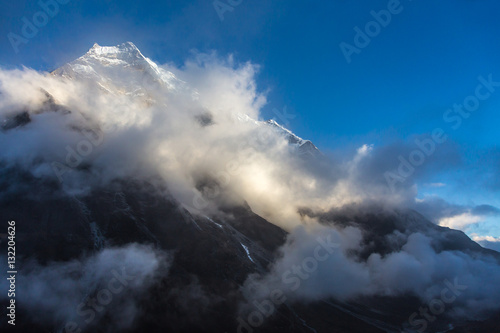 View of Mountain Peak and massive Cloud Front