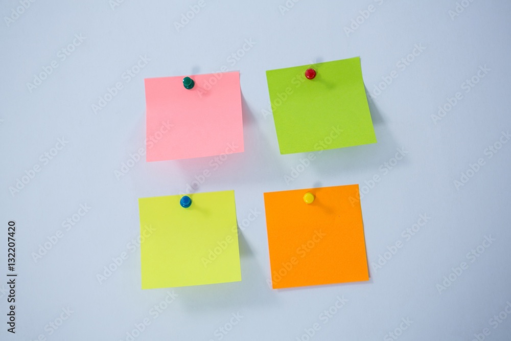 Multicolored adhesive note on white background Multicolored adhesive note on white background