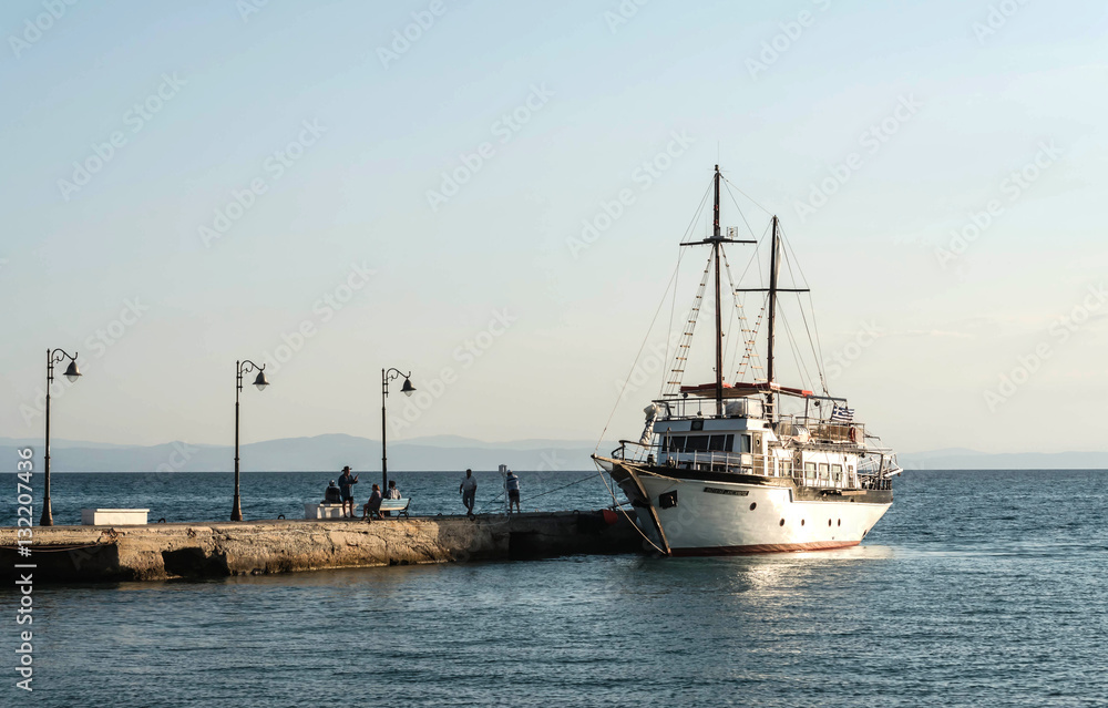 Fototapeta premium Anchored boat on the waterfront