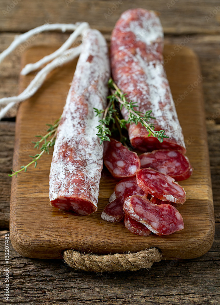 Typical traditional spanish salamis on wooden surface Typical traditional spanish salamis on wooden surface
