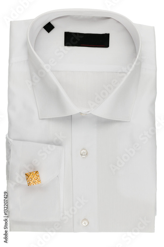 Folded white shirt with cufflinks