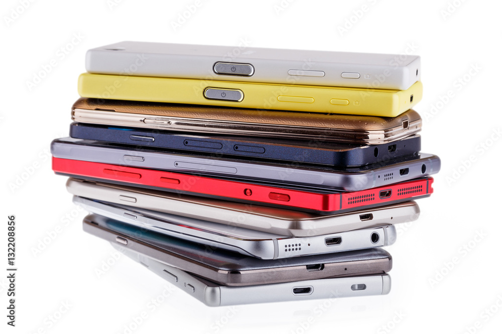 Pile of mobile phone. Heap of the different smartphones isolated Pile of mobile phone. Heap of the different smartphones isolated