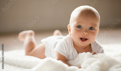 Portrait of small smiling  baby. photo