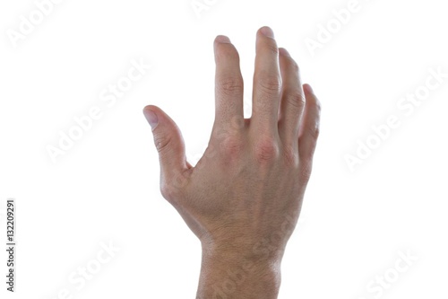 Hand of man pretending to touch an invisible screen