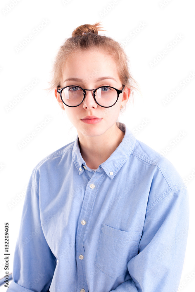 Young girl writer wearing blue shirt and big glasses Young girl writer wearing blue shirt and big glasses