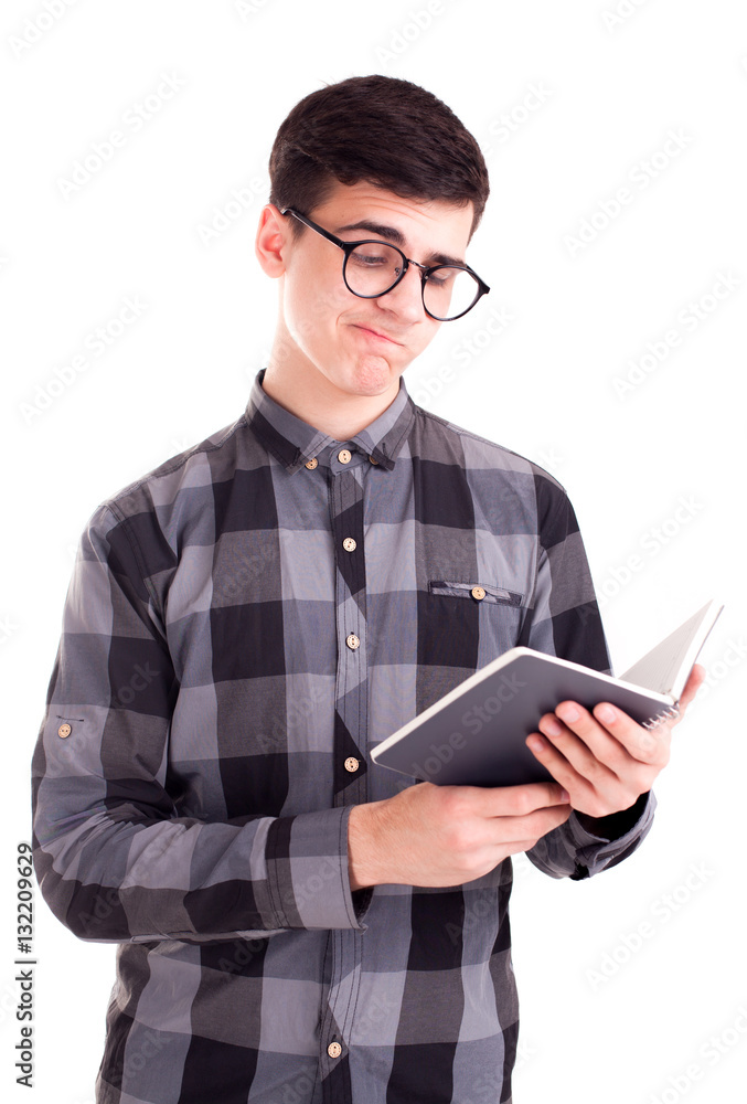 Student boy reading lecture in notepad isolated Student boy reading lecture in notepad isolated