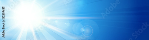 Blue sky with sun and lens flare panorama, header, banner