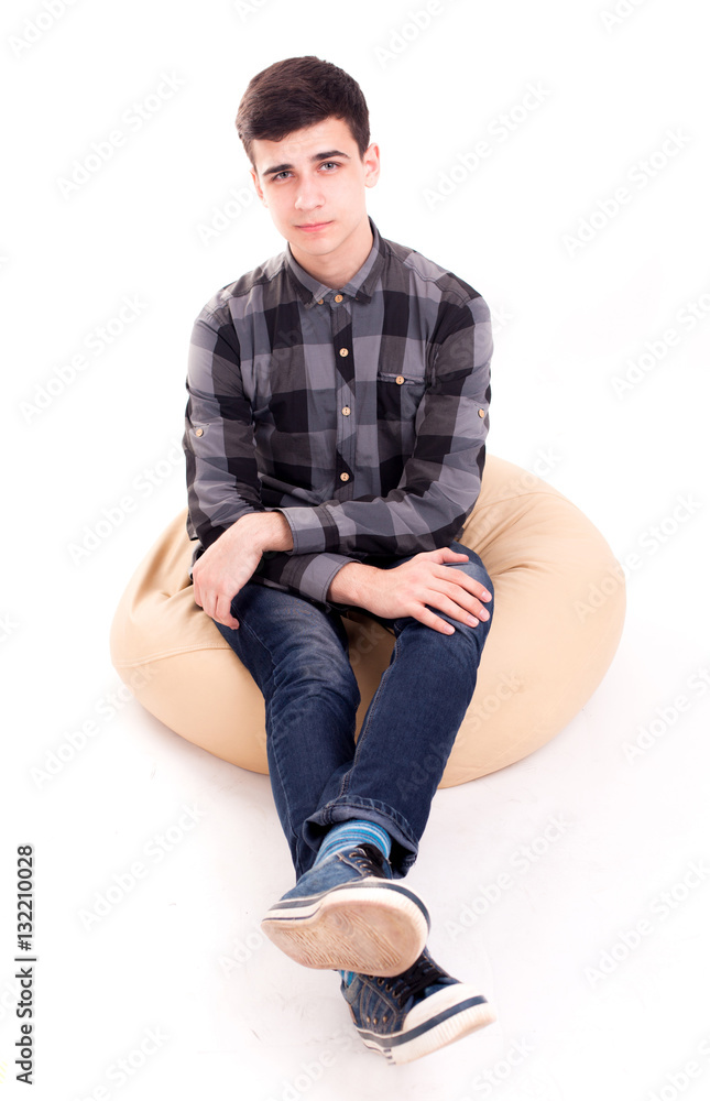 Man having rest in comfortable soft chair isolated