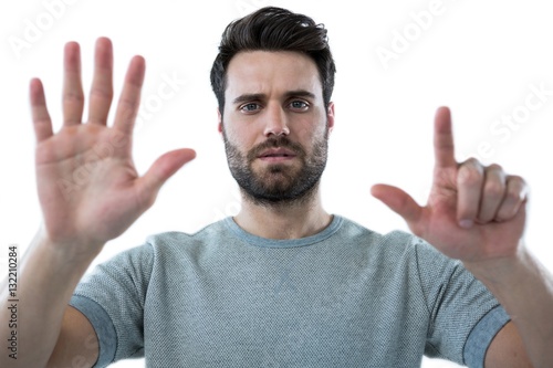 Man pretending to touch an invisible screen