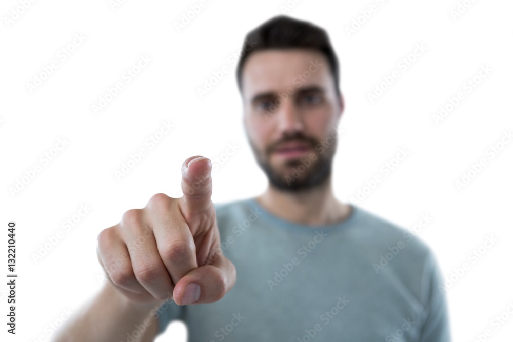 Man pretending to touch an invisible screen Man pretending to touch an invisible screen