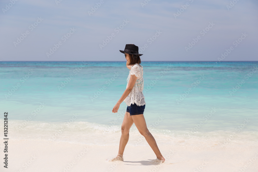 Outdoor summer portrait of young pretty woman sunbathing on the beach, enjoy her freedom and fresh air.