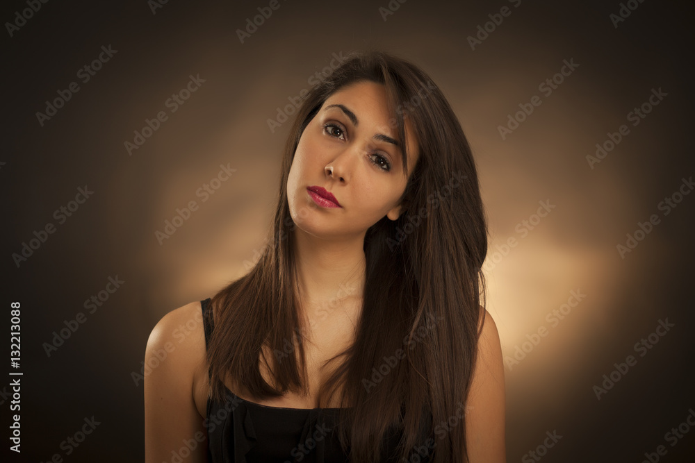 Beauty portrait of young smiling brunette woman . Studio light, yellow background Beauty portrait of young smiling brunette woman . Studio light, yellow background
