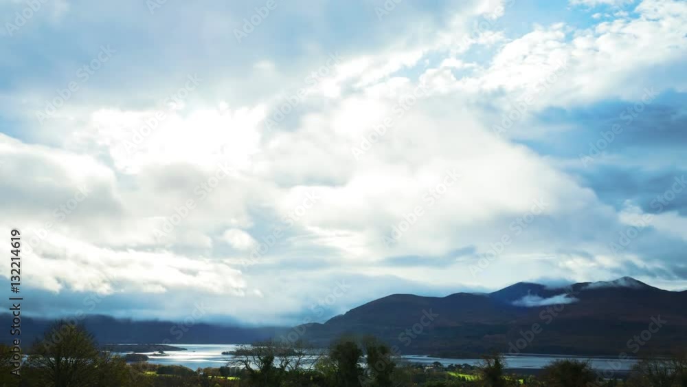 Timelapse shot of clouds rolling over mountains and lake on sunny day. Idyllic view of soft cloudscape moving through bright sun in sky. Scenic view of serene nature. 4K resolution.
Timelapse shot of clouds rolling over mountains and lake on sunny day. Idyllic view of soft cloudscape moving through bright sun in sky. Scenic view of serene nature. 4K resolution.