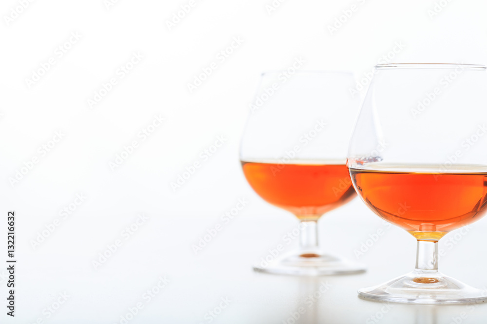Two cognac glasses on white background Two cognac glasses on white background