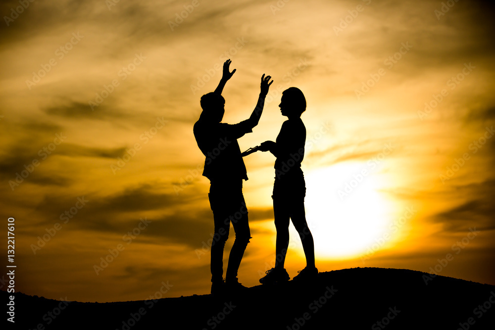 Silhouette man attacked by women with knife Silhouette man attacked by women with knife